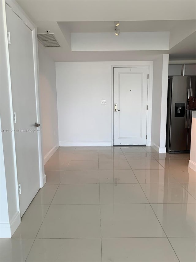 interior space featuring light tile patterned floors