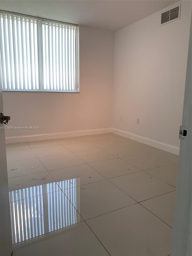 spare room featuring tile patterned floors