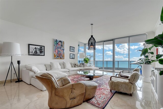 living room featuring ornamental molding, expansive windows, and a water view