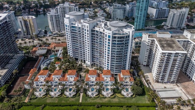 drone / aerial view with a water view and a view of the beach