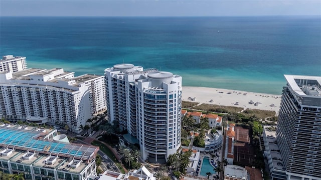 bird's eye view with a water view and a view of the beach