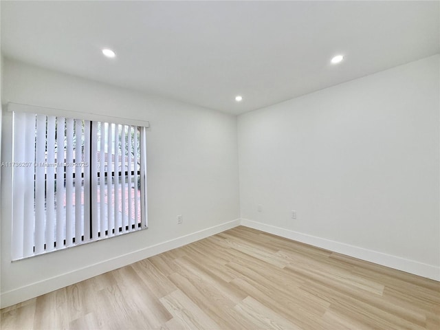 unfurnished room featuring light wood-type flooring