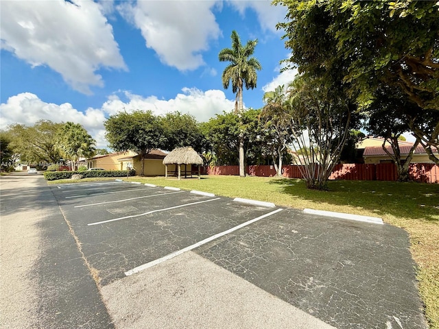 view of vehicle parking featuring a gazebo and a lawn