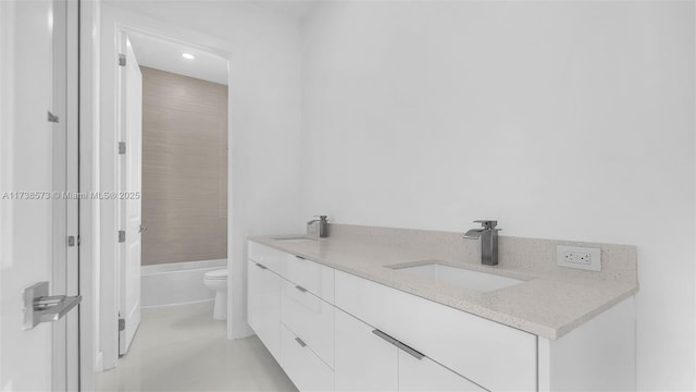 full bathroom featuring vanity, toilet, and bathing tub / shower combination