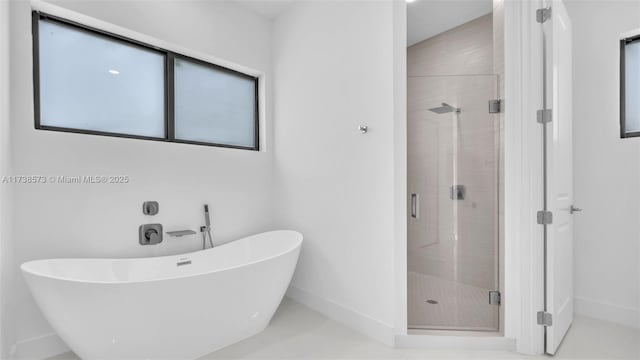 bathroom with independent shower and bath