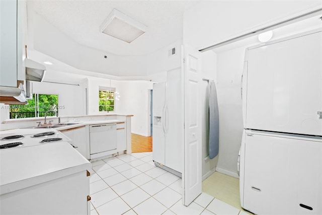 kitchen with sink, white appliances, and white cabinets