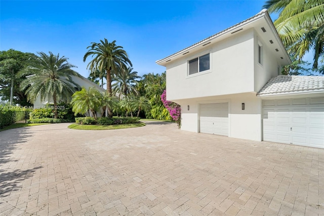 view of side of property featuring a garage