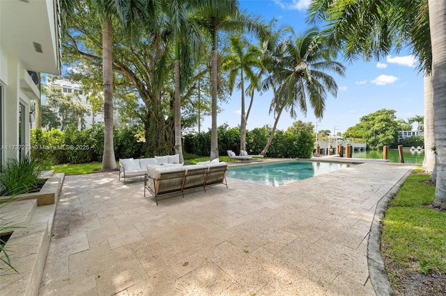 view of swimming pool with outdoor lounge area and a patio area