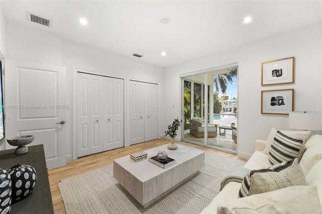 living room with light hardwood / wood-style flooring