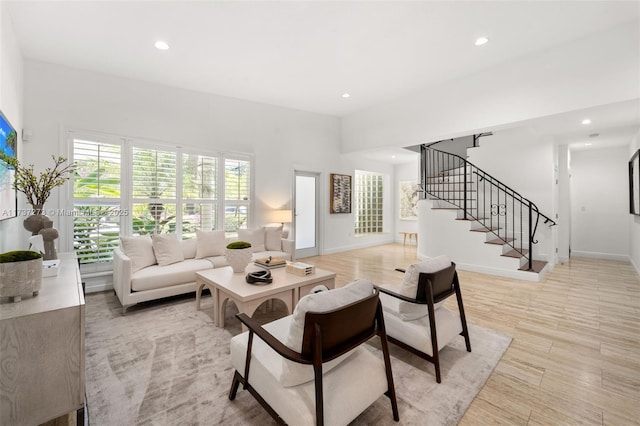 living room featuring plenty of natural light and light hardwood / wood-style floors