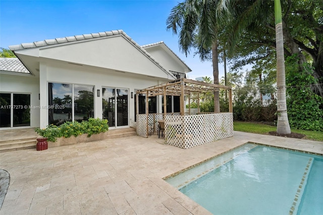 back of house featuring a pergola and a patio area