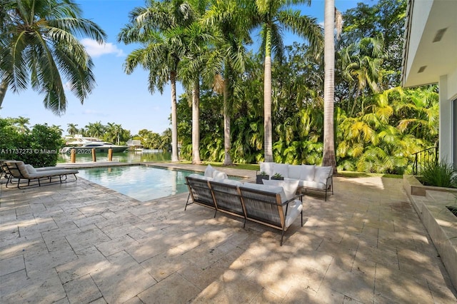 view of swimming pool featuring an outdoor living space and a patio