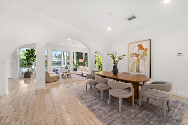 dining space with light wood-type flooring