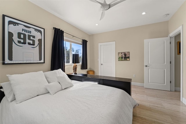 bedroom featuring ceiling fan and light hardwood / wood-style flooring