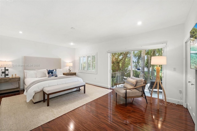 bedroom featuring access to exterior and hardwood / wood-style flooring