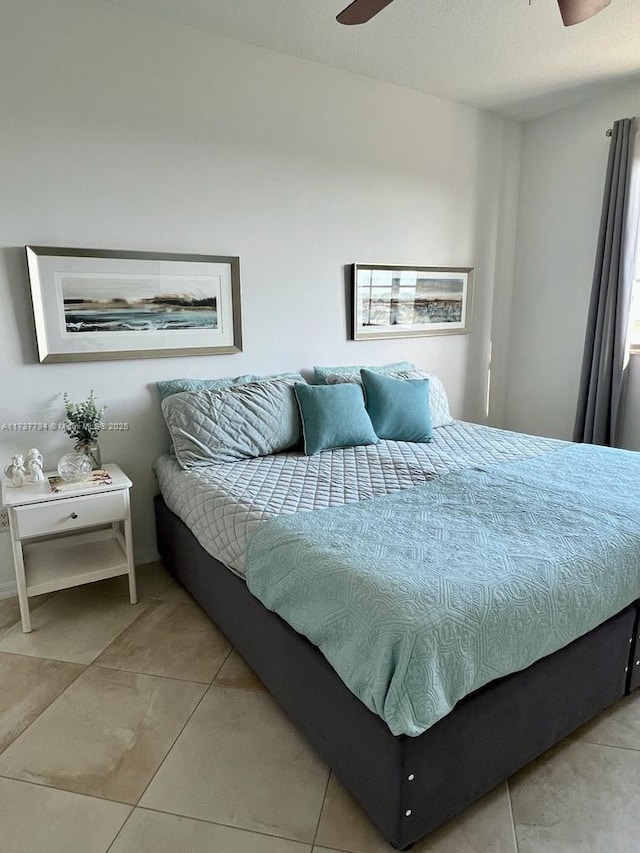 bedroom with light tile patterned flooring and ceiling fan