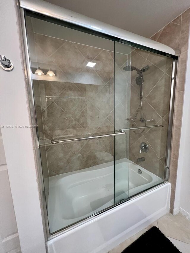 bathroom with tile patterned flooring and enclosed tub / shower combo