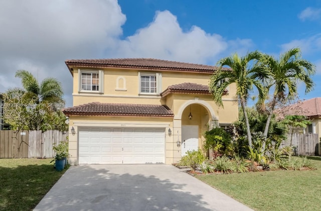 mediterranean / spanish house with a garage and a front lawn