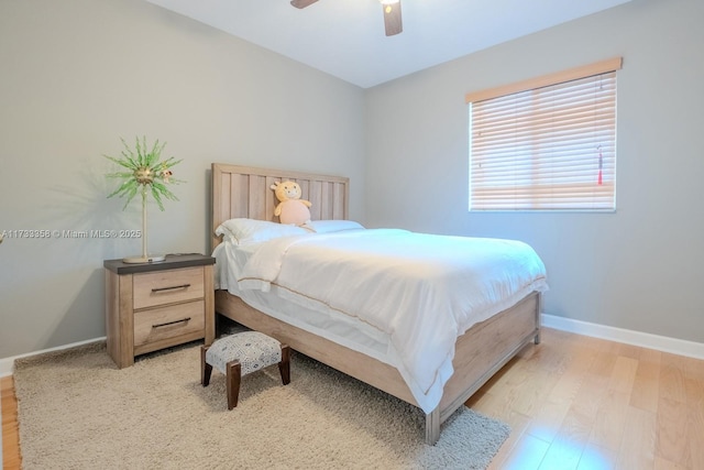 bedroom featuring ceiling fan and light hardwood / wood-style flooring