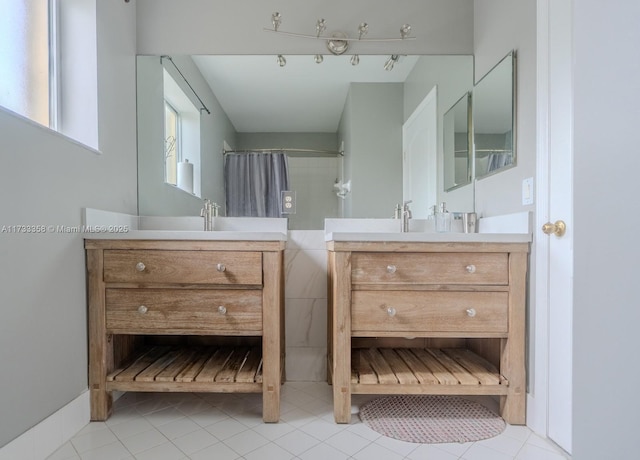 bathroom featuring tile patterned floors and vanity