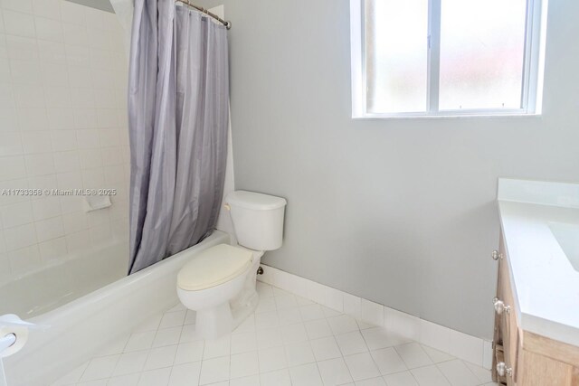 full bathroom featuring shower / tub combo with curtain, vanity, toilet, and tile patterned floors