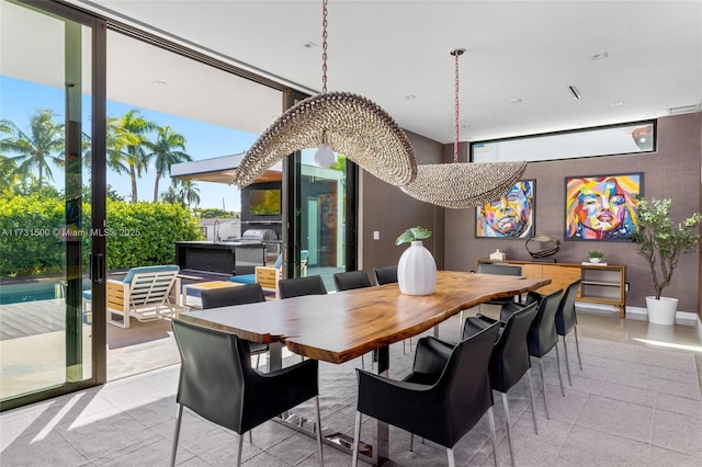 dining space with a wall of windows and french doors