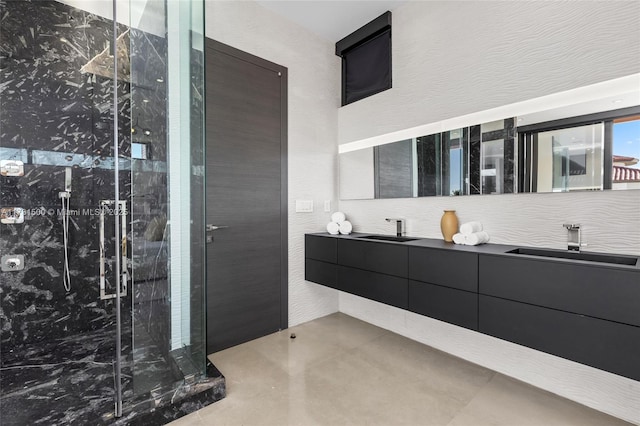 bathroom with vanity and a shower with shower door