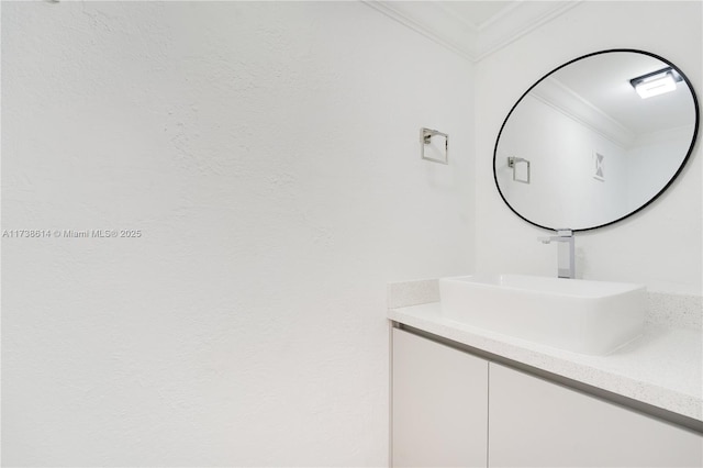 bathroom featuring vanity and crown molding