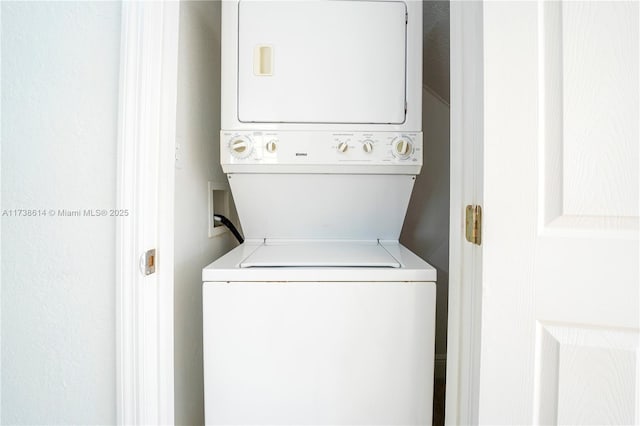 washroom featuring stacked washer and dryer