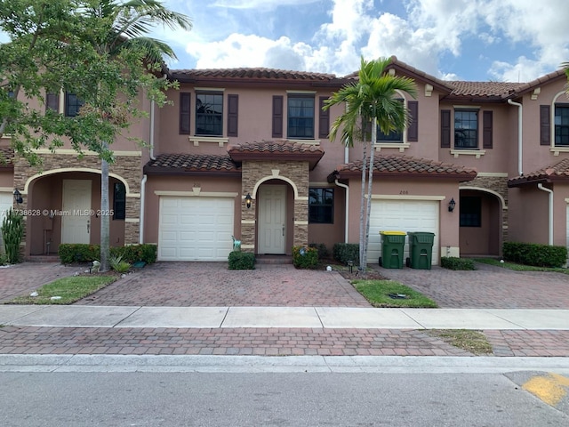 mediterranean / spanish house with a garage