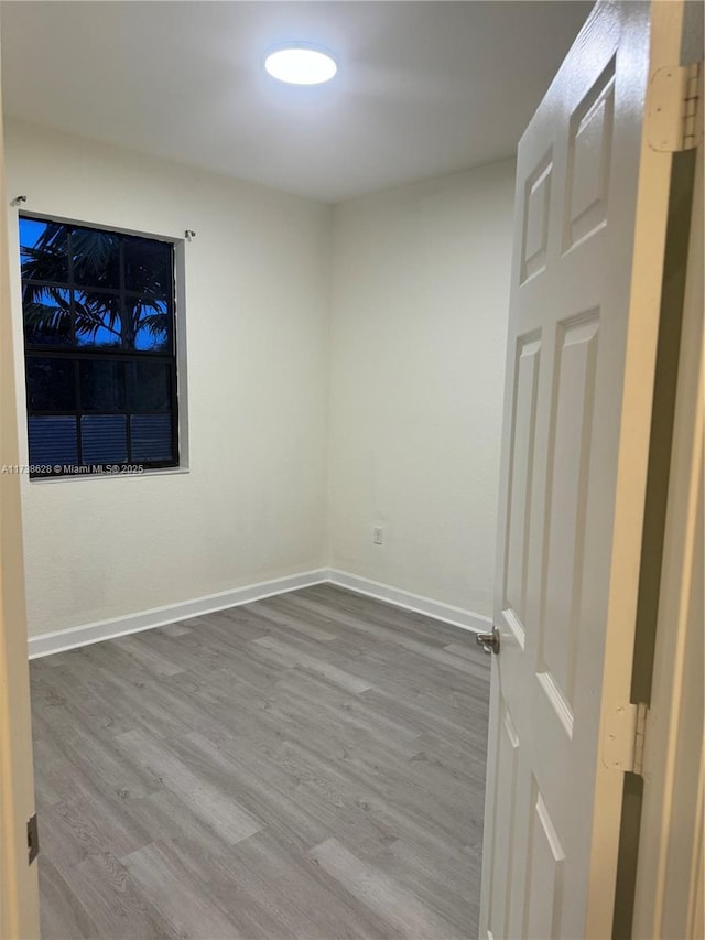 empty room featuring wood-type flooring