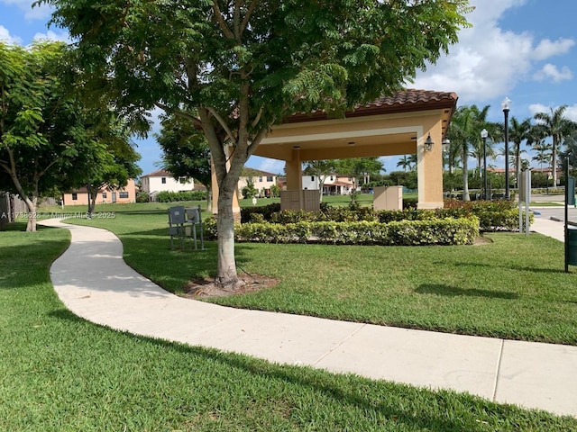 view of home's community with a gazebo and a yard