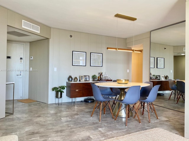 dining room featuring light hardwood / wood-style flooring