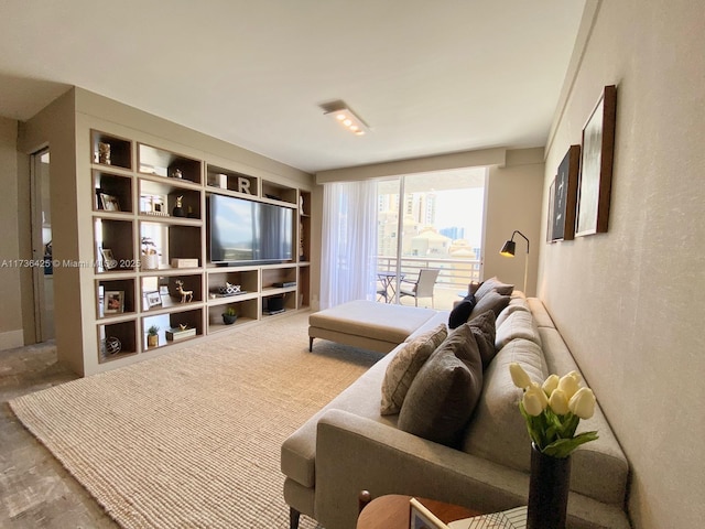 living room featuring carpet floors and built in features