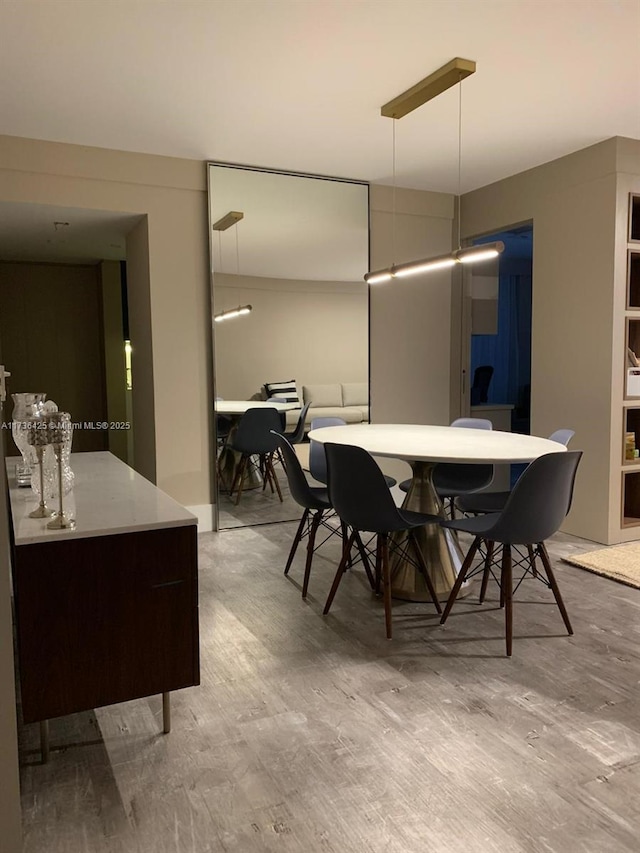 dining area with light hardwood / wood-style floors