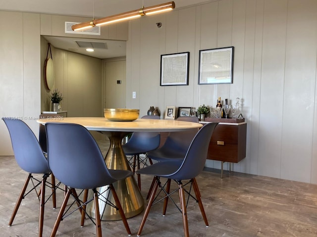 bar with hardwood / wood-style floors