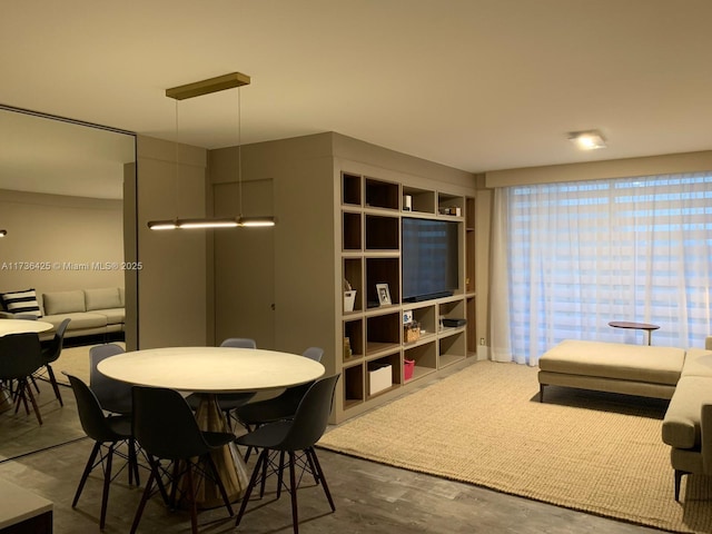 dining space with dark hardwood / wood-style floors