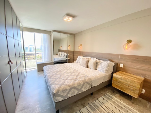 bedroom featuring concrete floors