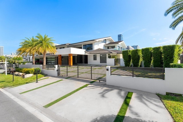 view of front of house with a fenced front yard and a gate