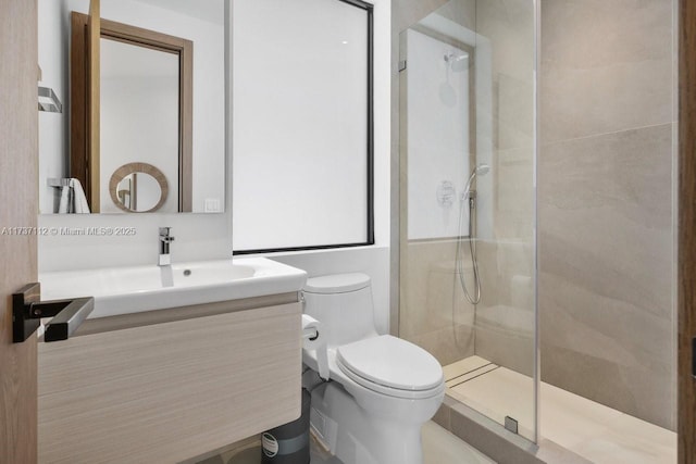 full bathroom with a stall shower, vanity, and toilet