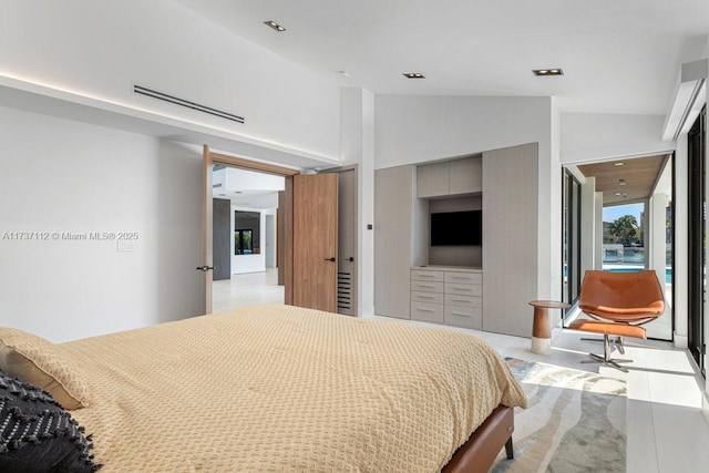 bedroom with visible vents and vaulted ceiling