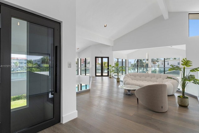 living room featuring high vaulted ceiling, beamed ceiling, wood finished floors, and baseboards