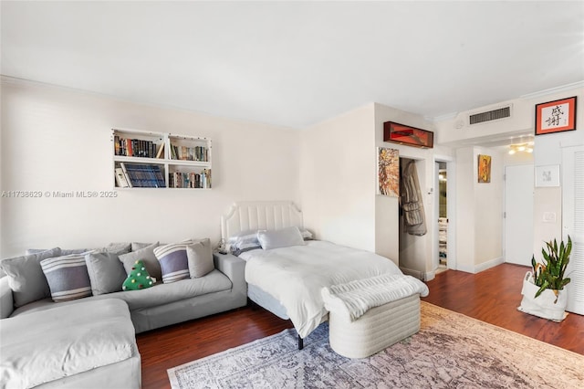 bedroom featuring dark hardwood / wood-style flooring