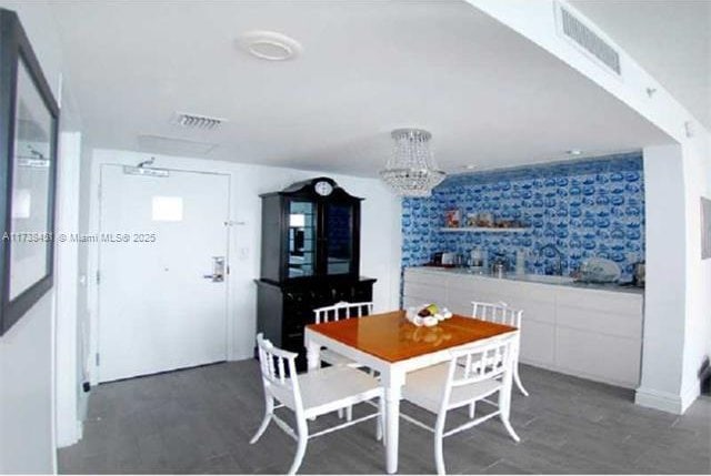 dining area with dark hardwood / wood-style flooring