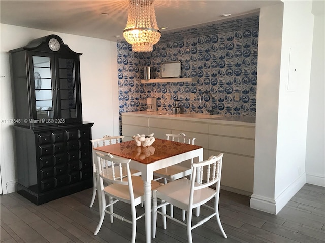 dining area featuring an inviting chandelier and hardwood / wood-style flooring