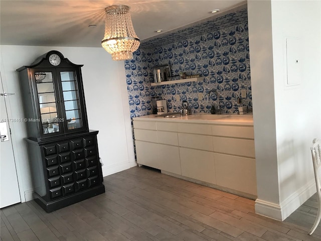 unfurnished dining area featuring dark hardwood / wood-style floors and sink