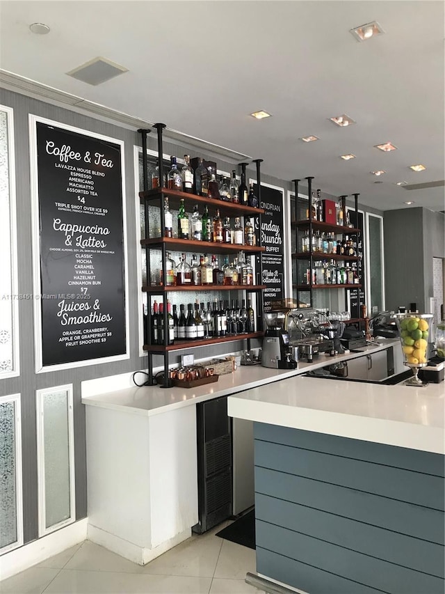 bar featuring light tile patterned floors