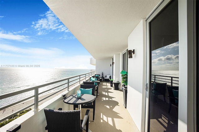 balcony featuring a water view