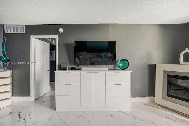 interior space with a textured ceiling