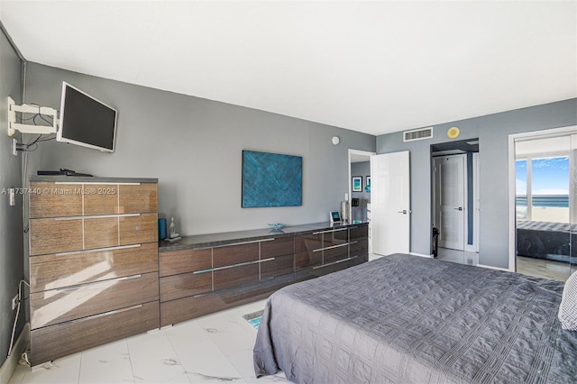 bedroom featuring a water view